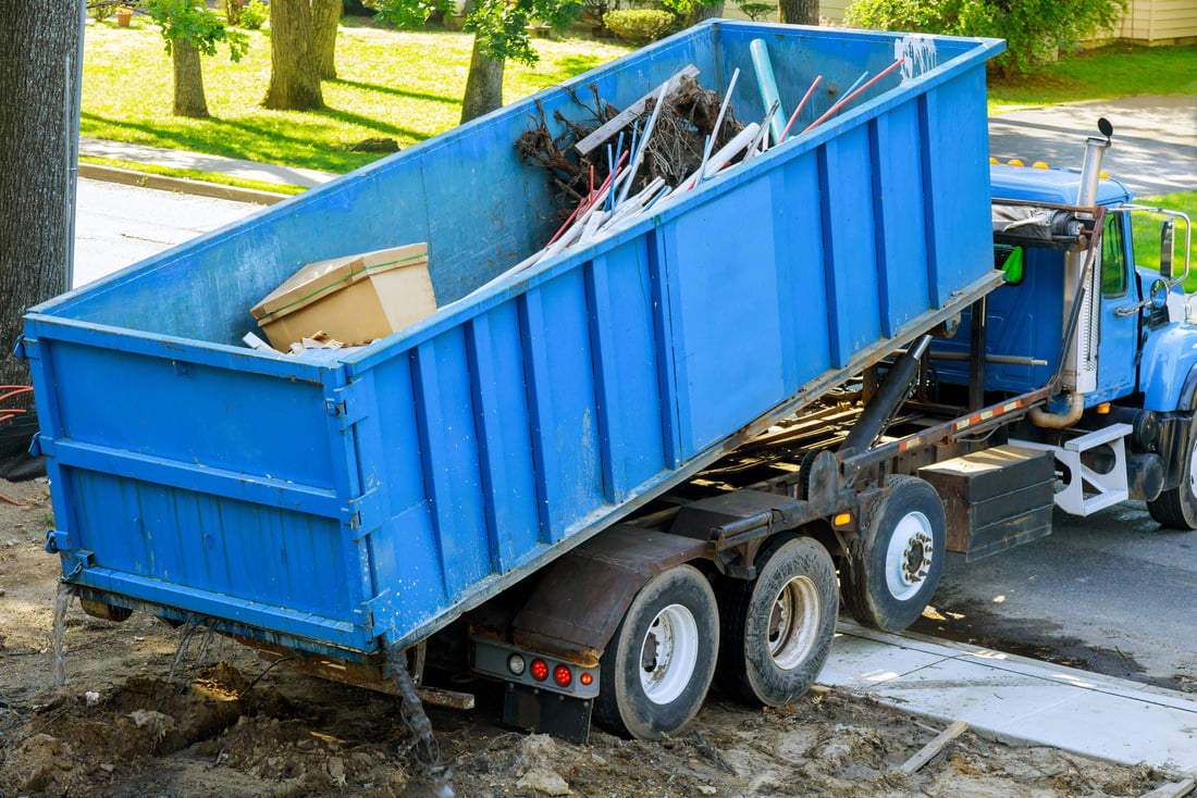 Dumpster on a Tow Truck